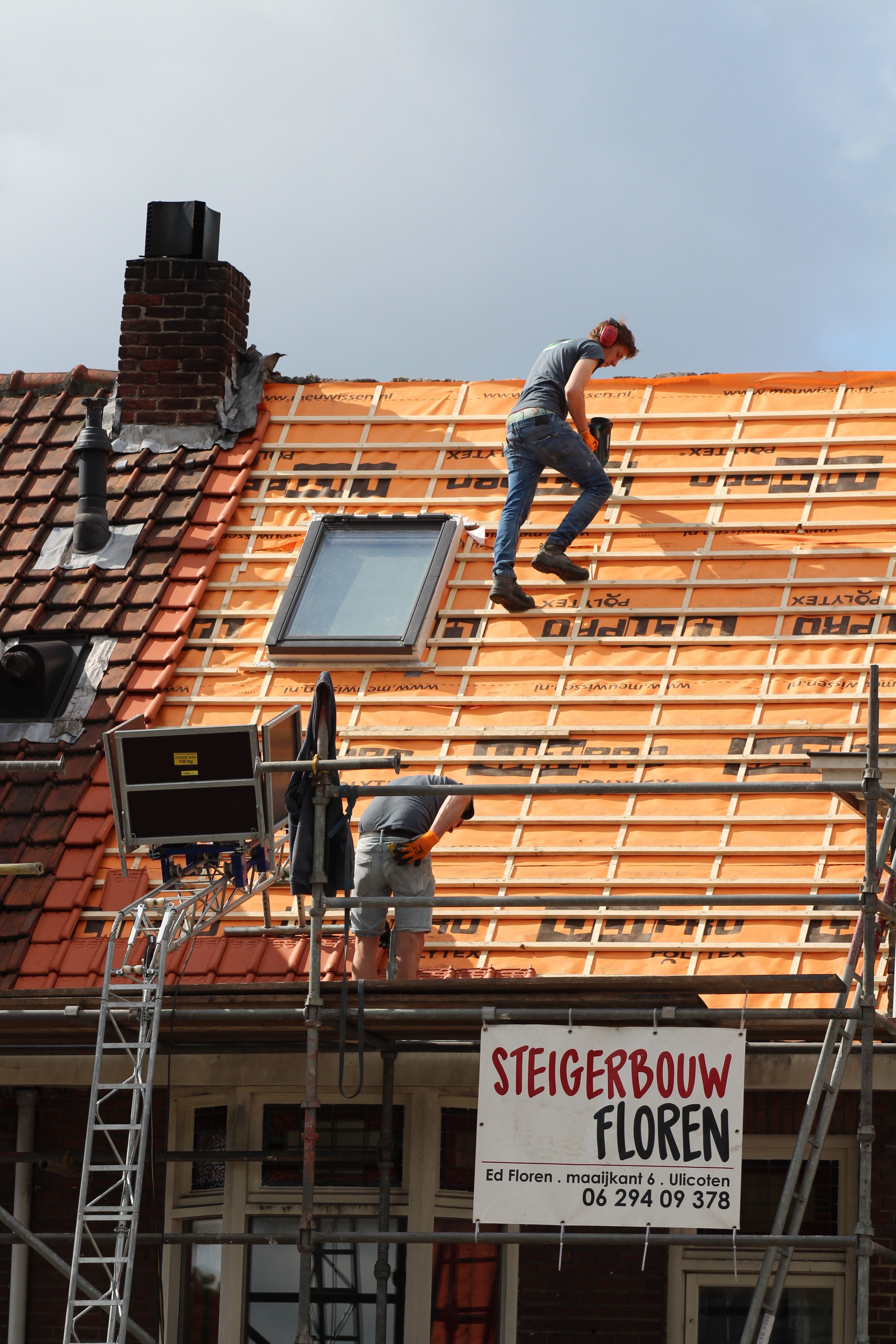 Professional roofing team working on a residential roof installation